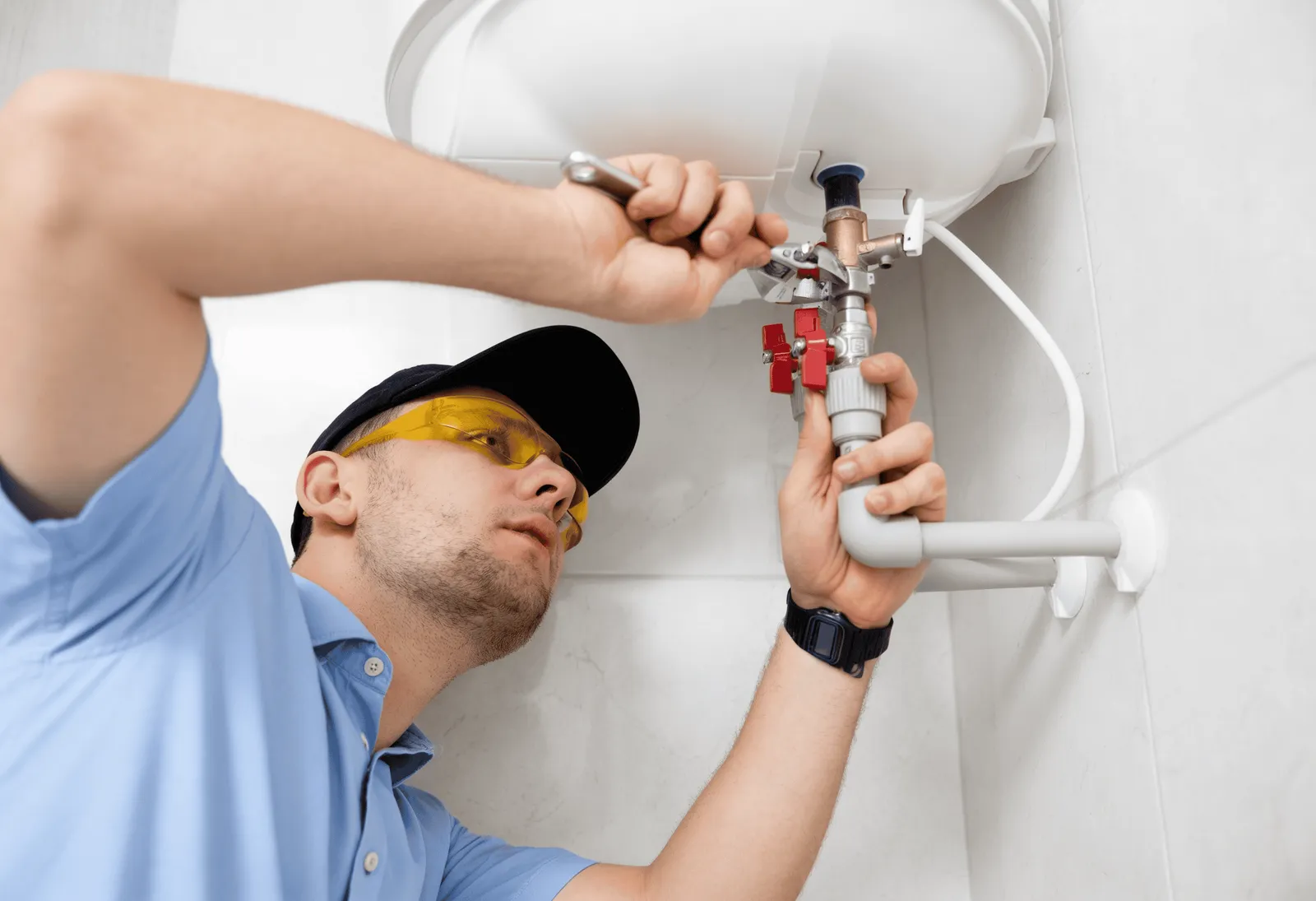Perfect Air and Water plumber repairing a home plumbing issue.