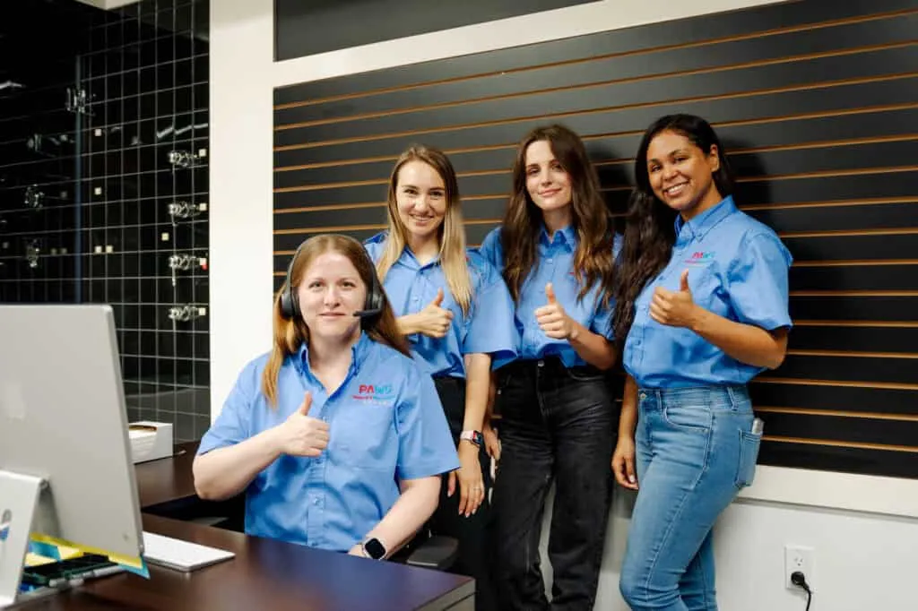 Friendly HVAC technicians in uniform at customer service center, offering expert heating and cooling solutions in New Jersey.