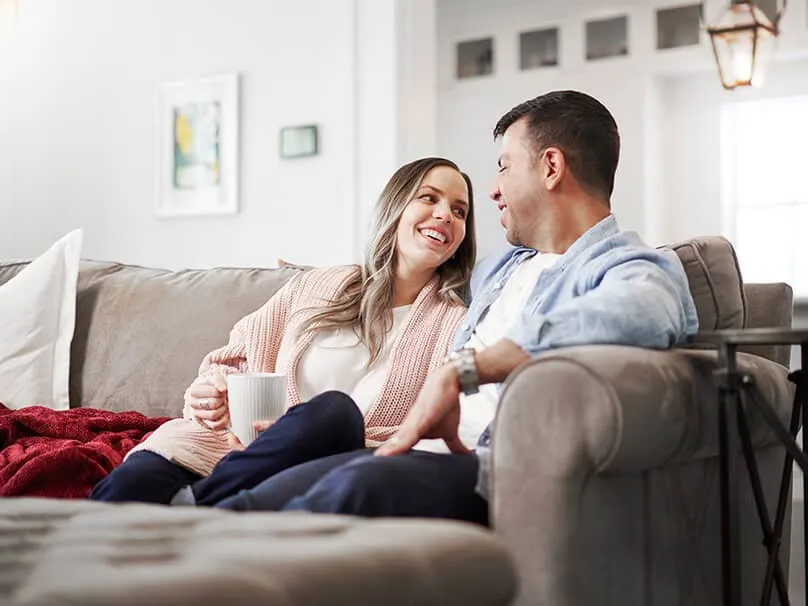 Couple relaxing in a home served by a packaged HVAC system.