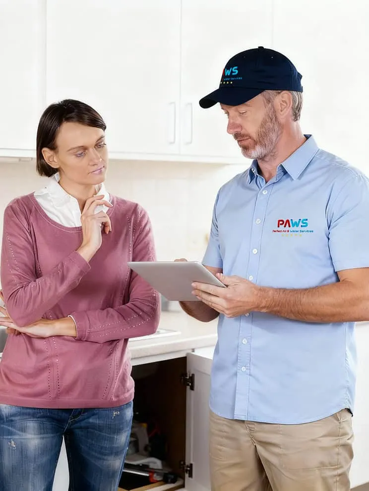 Perfect Air and Water technician greeting a customer at their home.