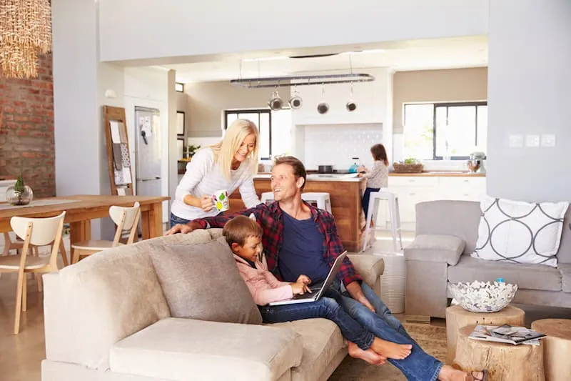 Family enjoying a comfortable home cooled by a new air conditioner.