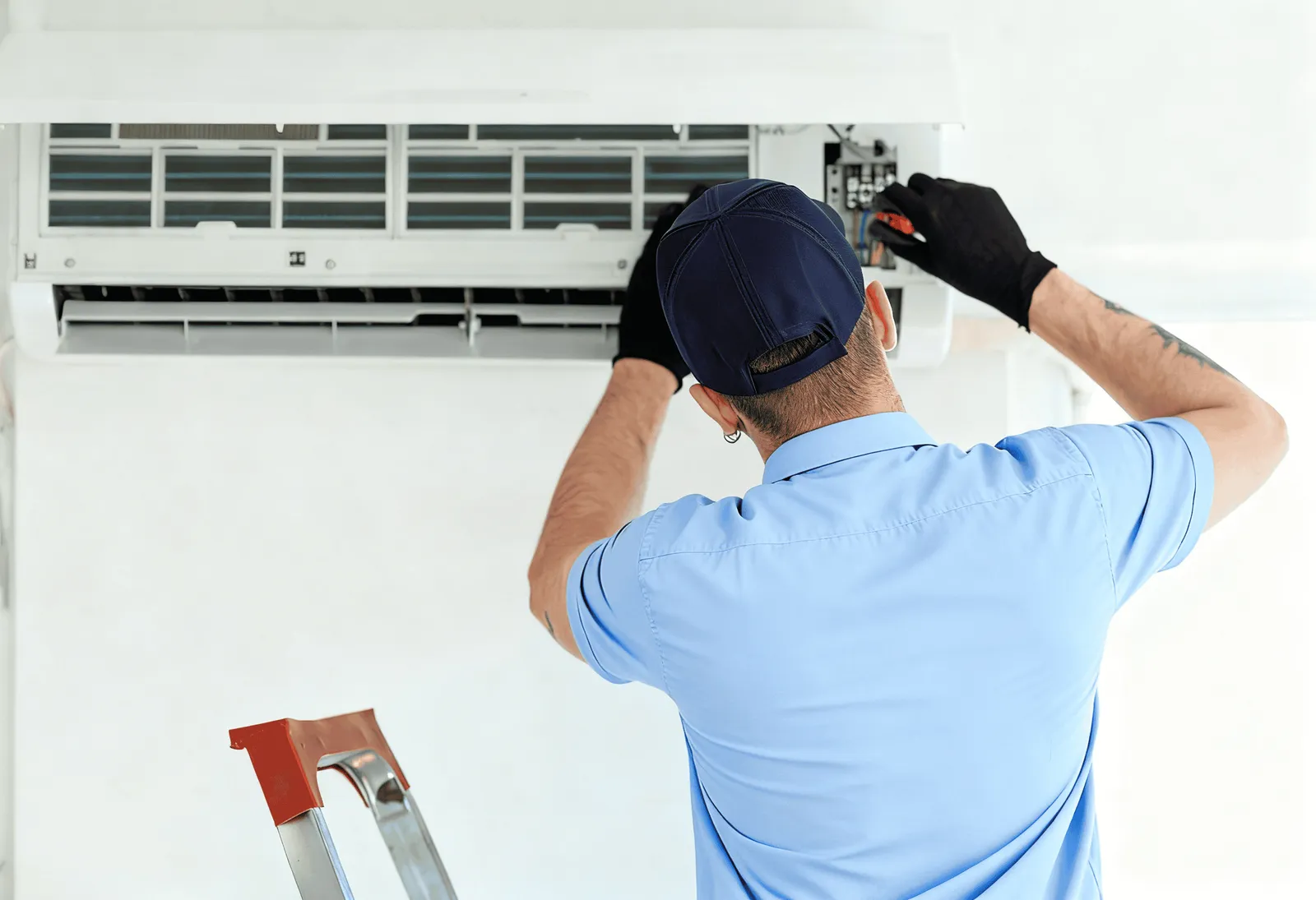 Perfect Air and Water technician installing a ductless mini-split unit.